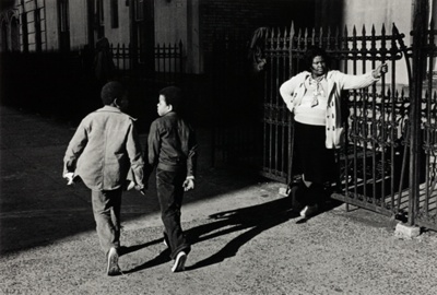 A Woman and Two Boys Passing