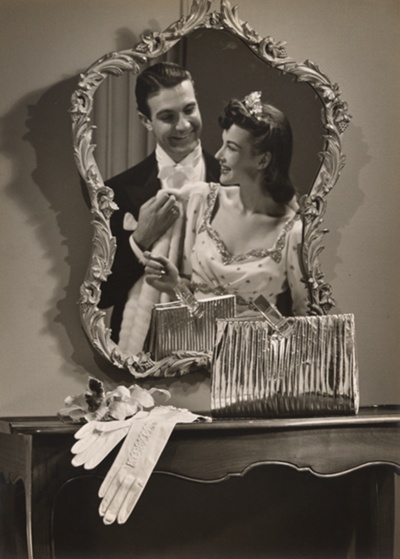 Fashion photograph: Metallic Evening Clutch with Couple’s Reflection in Mirror