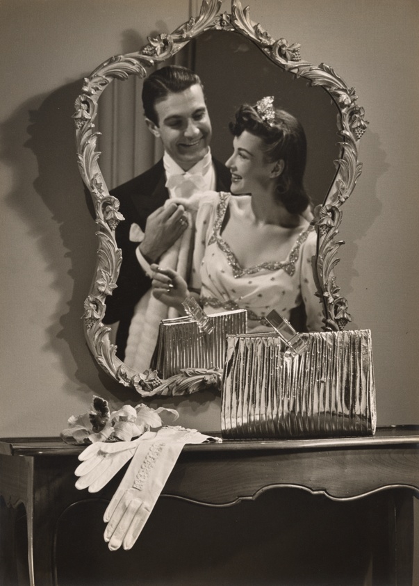 Fashion photograph: Metallic Evening Clutch with Couple’s Reflection in Mirror