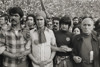Men stand arm and arm during Communist Party Meeting, Madrid, Spain