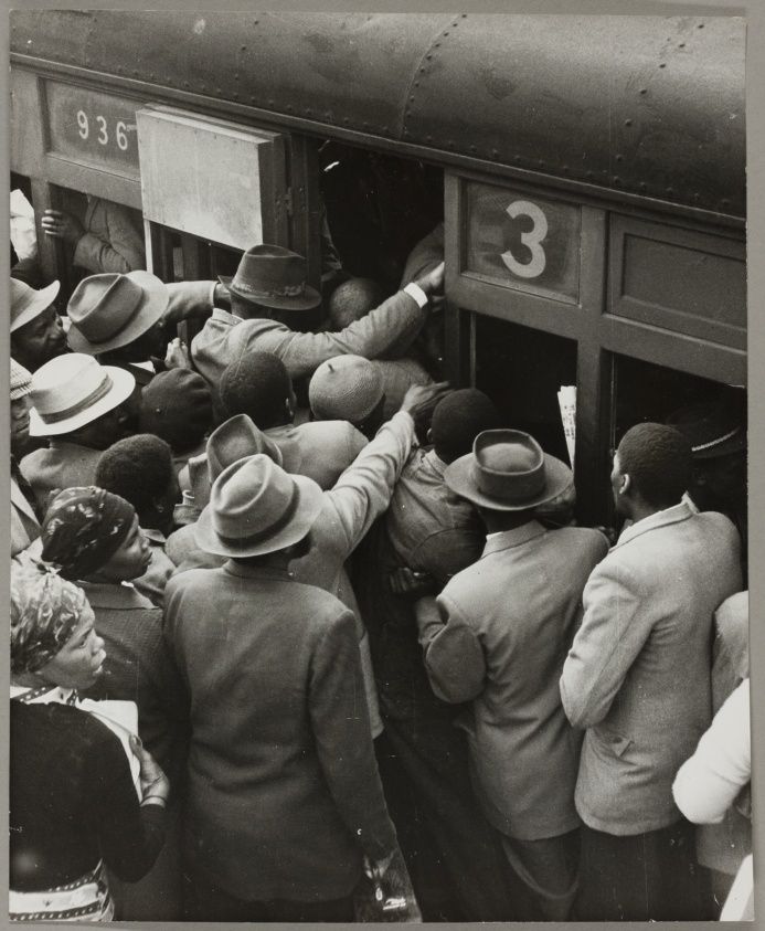 Hats and Men Cram onto Train No. 3
