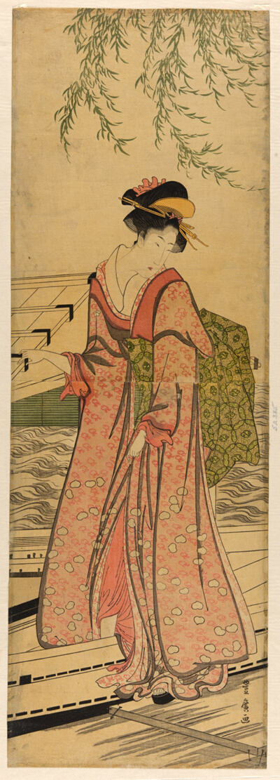 Young woman stepping out of a boat