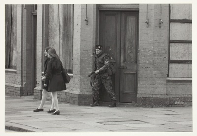 Schoolgirls and soldier