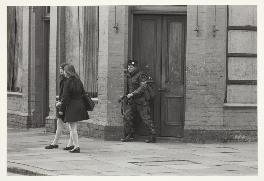 Schoolgirls and soldier