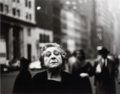 Woman on the Street with Her Eyes Closed
