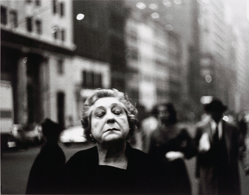 Woman on the Street with Her Eyes Closed