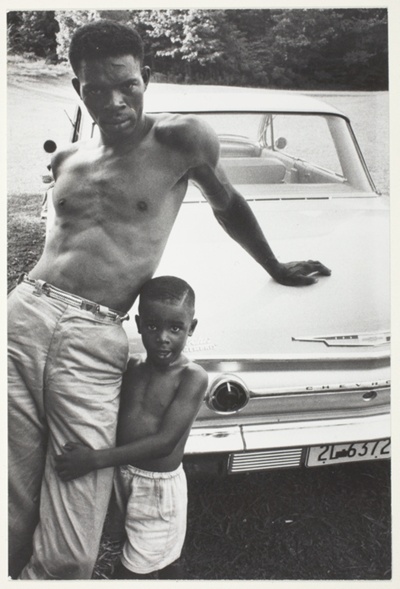 Man and Child Leaning on Car, Tennessee