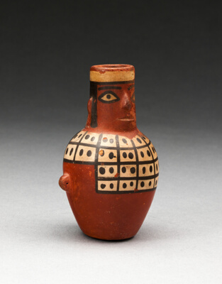 Miniature Jar in the Form of a Figure Wearing a Tunic