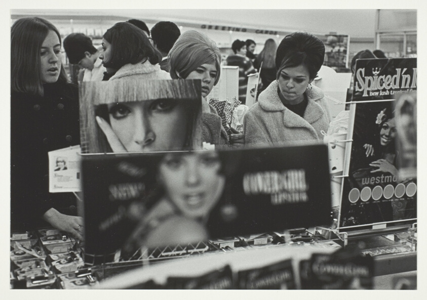 Untitled (Store Counter with Girls and Signs)