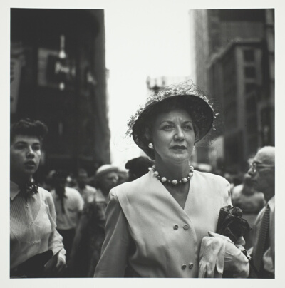 Woman in Crowd Holding White Glove