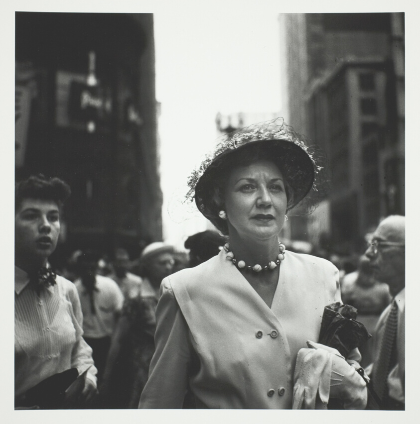 Woman in Crowd Holding White Glove
