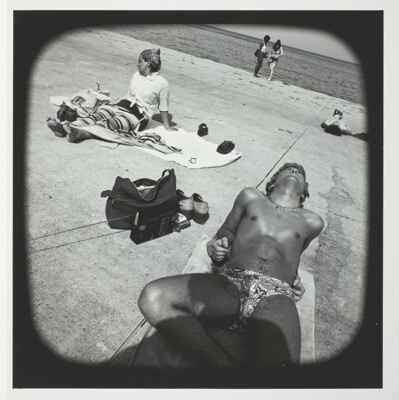 Untitled (Youth in Bathing Suit Sunning on Concrete at Lakefront), from the series "Beach"
