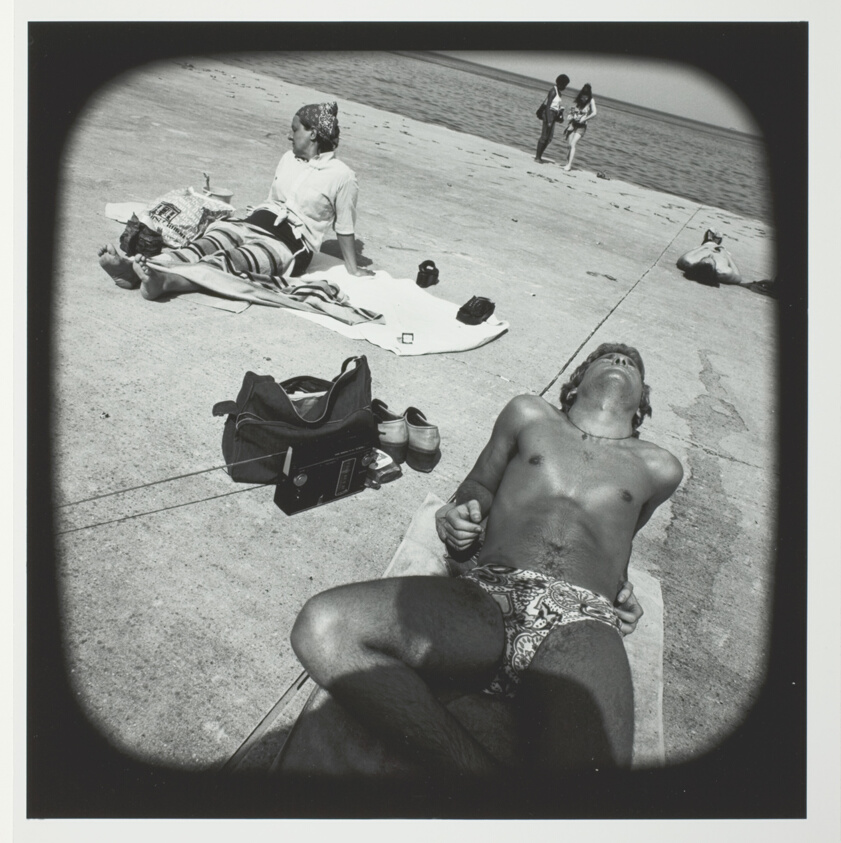 Untitled (Youth in Bathing Suit Sunning on Concrete at Lakefront), from the series "Beach"
