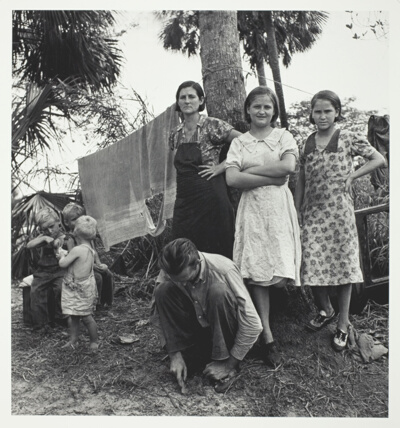 Migrant Agricultural workers camping out in cane bush near Homestead, Fla. One of the women said, "we ain't never lived like hogs before, but we sure does now."
