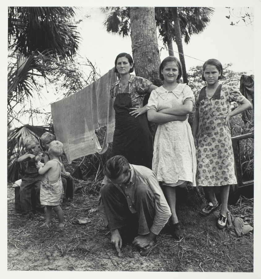 Migrant Agricultural workers camping out in cane bush near Homestead, Fla. One of the women said, "we ain't never lived like hogs before, but we sure does now."