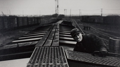 A Brakeman Rides a String of Cars Down the Hump