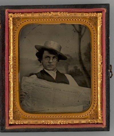 Untitled (Portrait of a Man Holding a Newspaper and Wearing a Straw Hat)