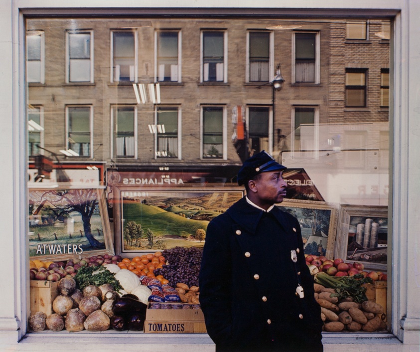 Ithaca-Policeman in Front of Fruit Stand