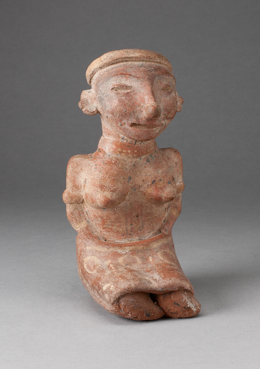Seated Female Figurine with Patterned Skirt