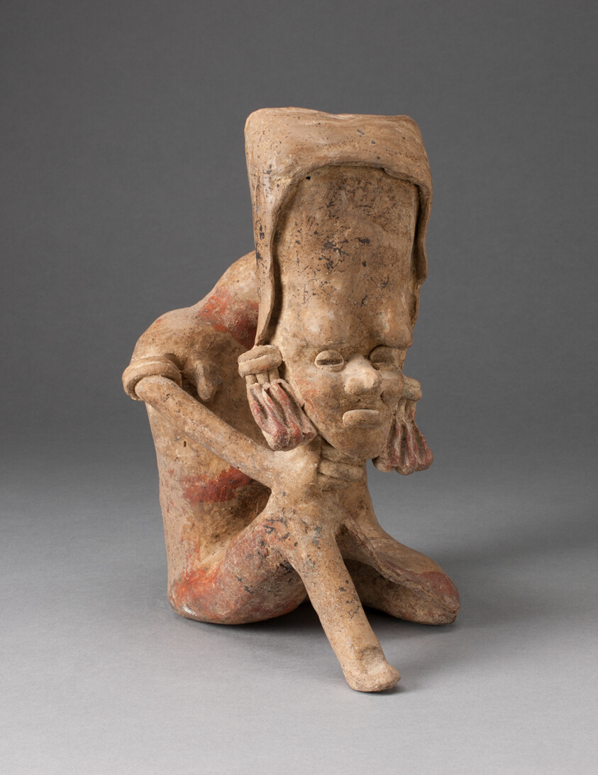 Seated Figure with an Elongated Head and Chin Placed on Knee