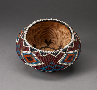 Polychrome Beaded Basket with Repeated Diamond and Triangle Motifs