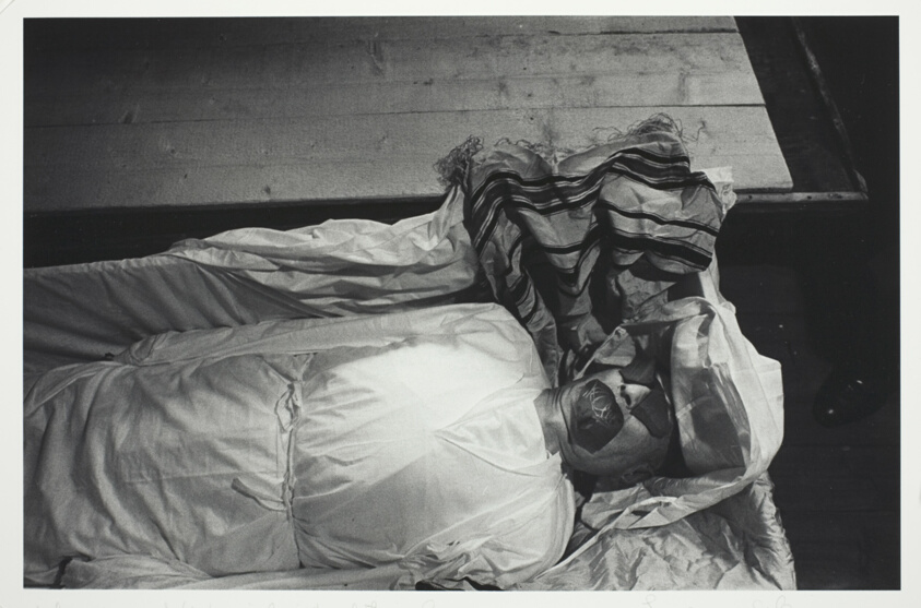 Black Pot Shards Covering Eyes and Mouth of a Body being Prepared for Burial