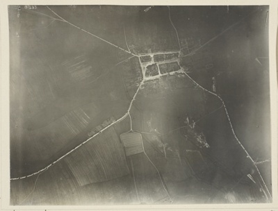 Photography from 20,000 ft. Small specks on road are troops. The number of troops in this particular movement was calculated exactly from this set of photographs. (The weather was dull when picture was taken and troops did not see airplane, otherwise an effort would have been made to conceal them)
