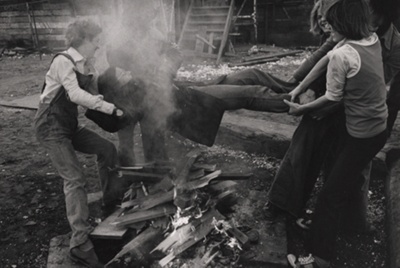 Boys Holding Girl over Bonfire, Manchester, England