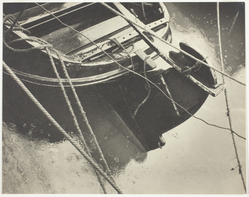 Parts of Rowboat and Raindrops in Harbor, Veere