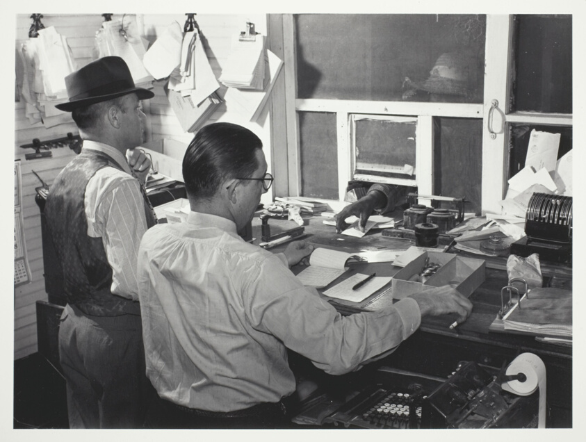 Cashiers Paying off Cotton Pickers in Marcella Plantation Store, Mileston, Mississippi