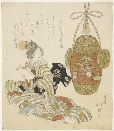 Woman with book sitting next to a New Year pull toy
