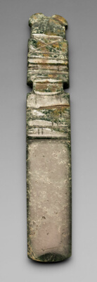 Celt Pendant Depicting an Abstract Figure with a Tall Headdress