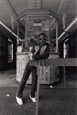 A Boy in Front of the Loews 125th Street Movie Theater, from the portfolio "Harlem, U.S.A." (2005)