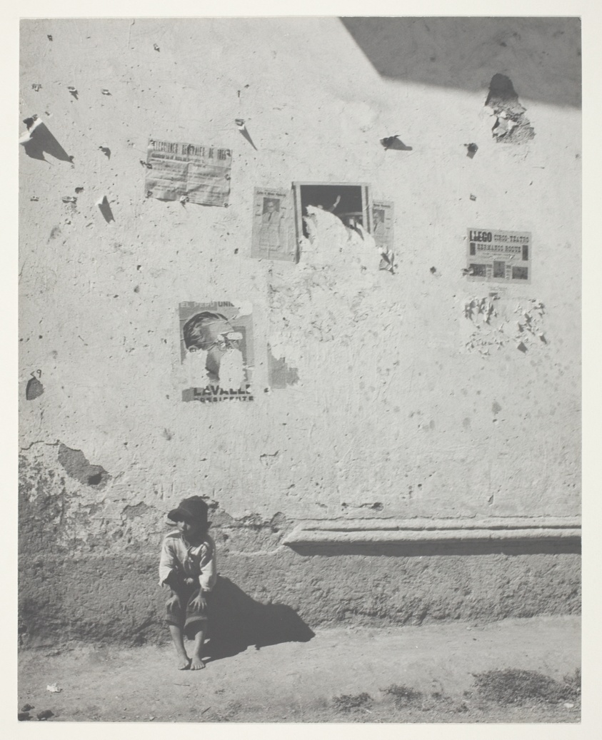 Peruvian Child Seated by a Wall