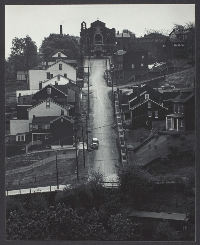 Street in Pittsburgh: Downhill; houses on either side; church at end of street
