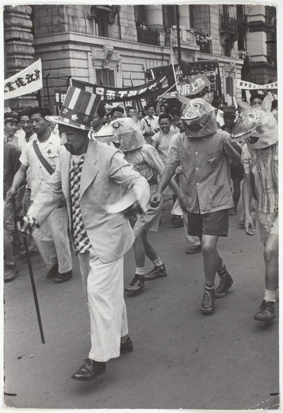 Masks and Banners in Anti-US Shanghai Parade