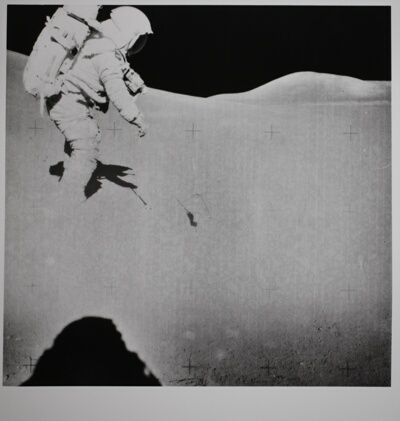 Untitled (David R. Scott gathering lunar regolith samples while conducting senelogical experiments on the Moon, with Iriwn’s Shadow in the Left Foreground)
