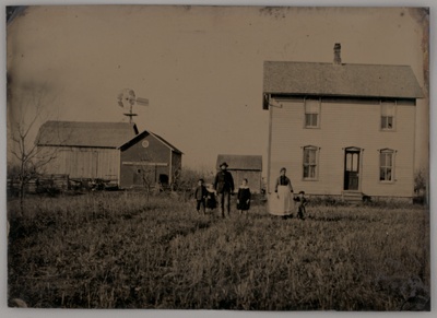 Untitled (A Man, a Woman, and Three Children Standing in Front of a Farmhouse)