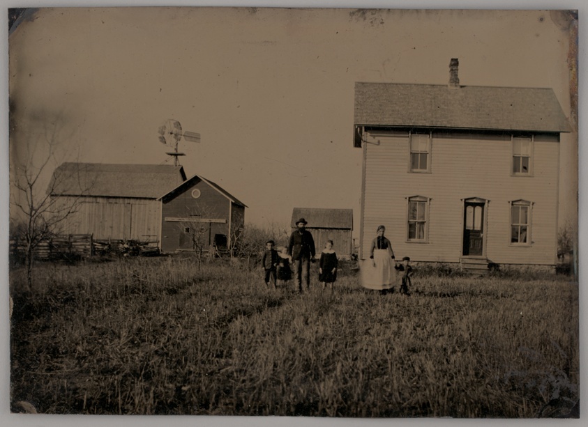 Untitled (A Man, a Woman, and Three Children Standing in Front of a Farmhouse)