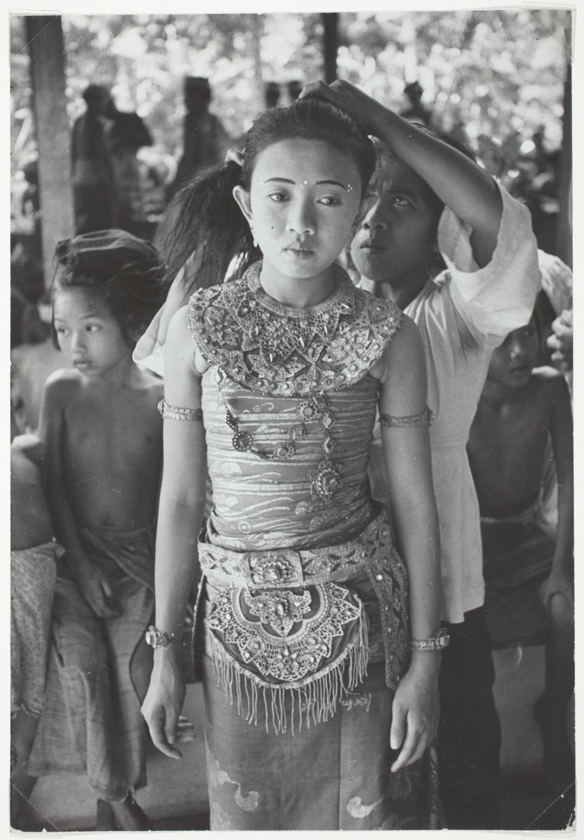 Girl Standing Patiently While Hair is Arranged, Indonesia